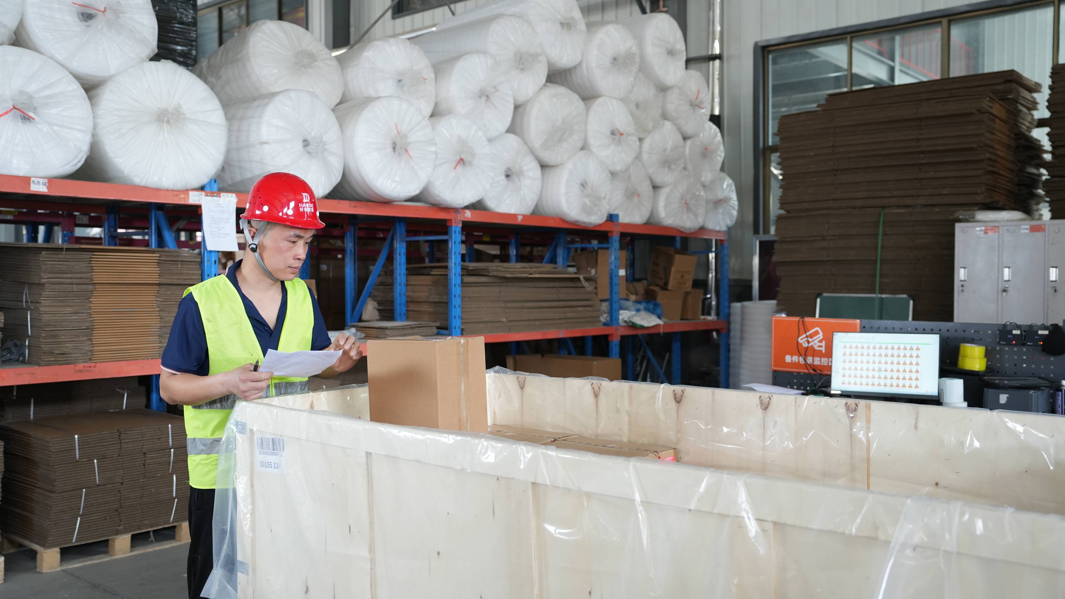 Logistics team packs and labels goods
